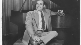 Western swing pioneer Bob Wills at a piano.