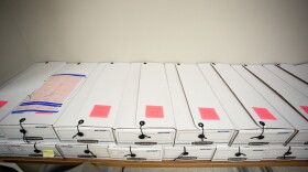 Boxes of absentee ballot requests sit at the Durham County Board of Elections office in Durham, N.C. on Tuesday, Aug. 18, 2020. The county has seen an increase in the number of absentee ballot requests for the 2020 election during the coronavirus pandemic. 