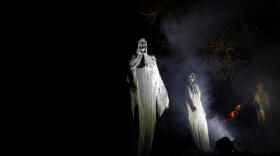 Halloween ghost statues are seen in the park during a Halloween celebration in Vilnius, Lithuania. (Mindaugas Kulbis/AP)