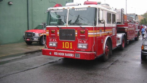 Photo No: 19882. Manufacturer: Seagrave. FDNY Ladder 101 parked opposite it home station in Brooklyn. The crowd of people crossing at the rear of the vehicle are making there way to the start of the Tunnel to Towers Charity run. This annual event retraces the foot steps made by a FDNY firefighter called Stephen Siller who had to run from Brooklyn to Manhattan when the Twin Towers were on fire, unable to get through in his car. The run goes through the Battery Tunnel (2 miles long) which joins Brooklyn with Manhattan. This years run attracted 25000 competitors from all over the world.