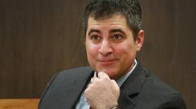 Justin Nadeau, a former lawyer in Portsmouth, is seen testifying in court in Dover in May 2015.