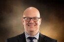 A headshot of Shawn Johnson.