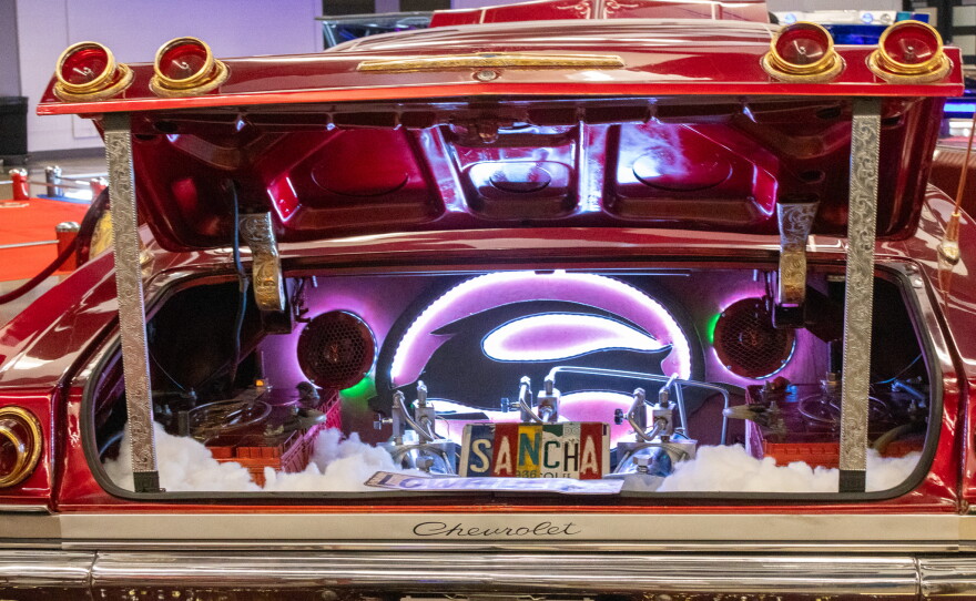 Trunk of Wes Jennings’ red 1965 Chevrolet Impala that says “Sancha” spelled out on pieces of a license plate. Photo by Alexander Brown