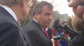 New Jersey Gov. Chris Christie answers questions about a sports gambling case after Supreme Court arguments on Monday.