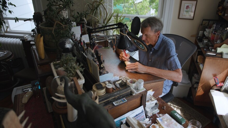 Scrimshaw artist Brian Kiracofe works in his studio.