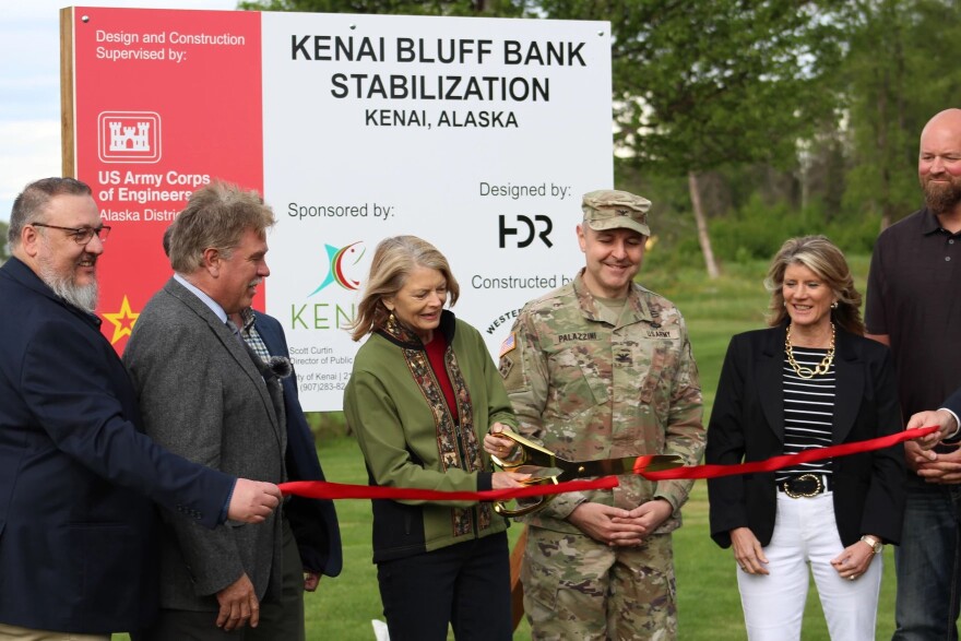 U.S. Sen. Lisa Murkowski (center) cuts the ribbon during a ceremony to celebrate the start of construction on the Kenai bluff stabilization project on Monday, June 10, 2024 in Kenai, Alaska.