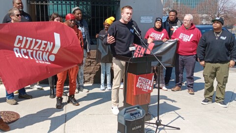 Ravo Root, political director at Citizen Action of New York, speaks in downtown Buffalo Thursday, April 9, 2026 to open a news conference.