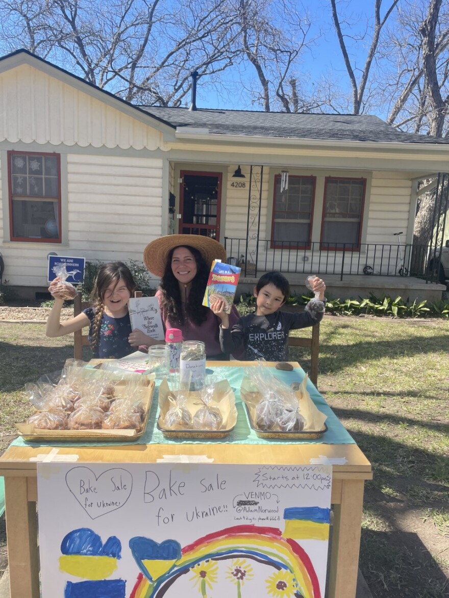 Locke Riti, his cousin, Maple, and his aunt, Marsha, sell pastries to support Ukrainians.