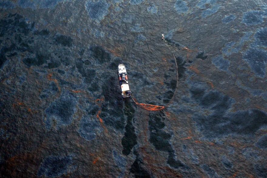 A boat collects oil that leaked from the Deepwater Horizon wellhead in the Gulf of Mexico in April 2010 near New Orleans.