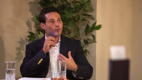 Arturo Alluin, a candidate in the District 8 city representative race, speaks to members of the League of Business at his restaurant, Mykonos Mediterranean Steakhouse, Aug. 20, 2026