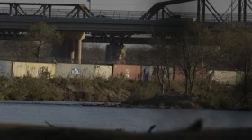 Shipping containers line the bank of the Rio Grande at Shelby Park in Eagle Pass on Jan. 19.