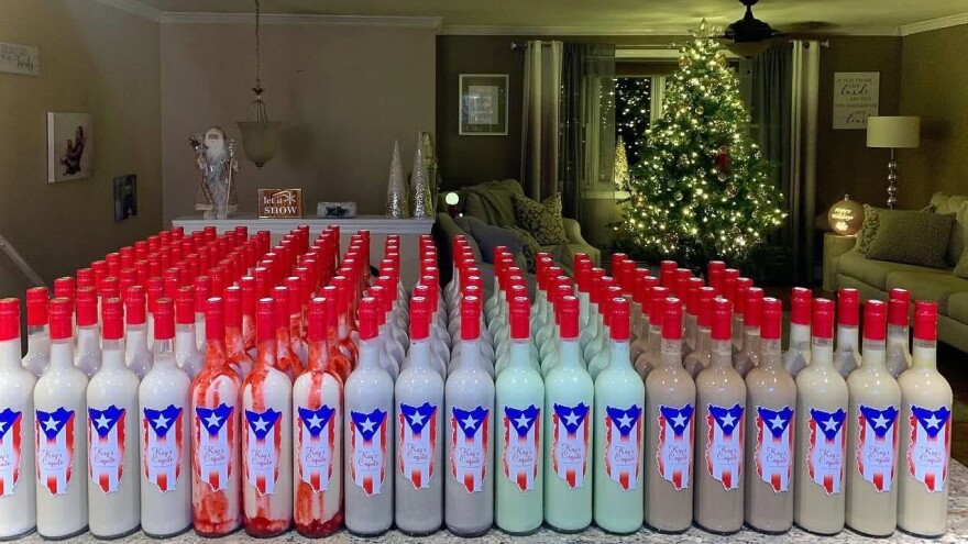 Continuing a tradition and recipe for coquito inspires Kayla Lalles where she lines up bottles ready for distribution in her Berlin, Ct., home.