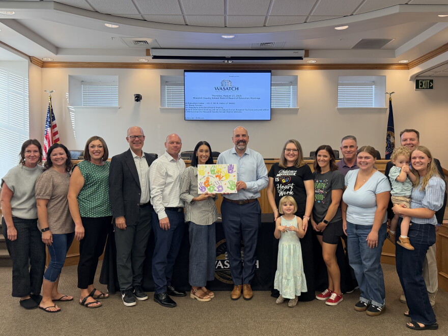 Wasatch County School District Board of Education members celebrate the opening of the district's first childcare center with center staff, students and parents on Aug. 27, 2026.