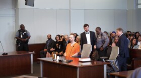 Before a packed courtroom, Hicks pleaded guilty to three counts of first-degree murder. 