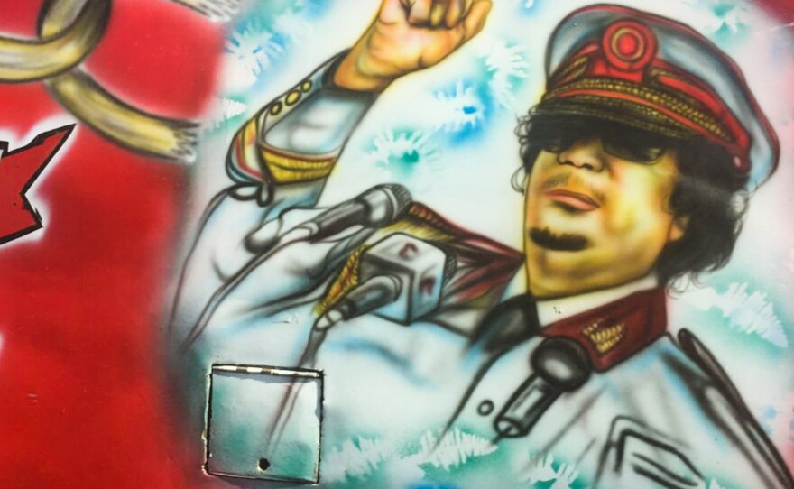Yes, that is the late Libyan leader Moammar Ghadafi. On a bus. In Nairobi.