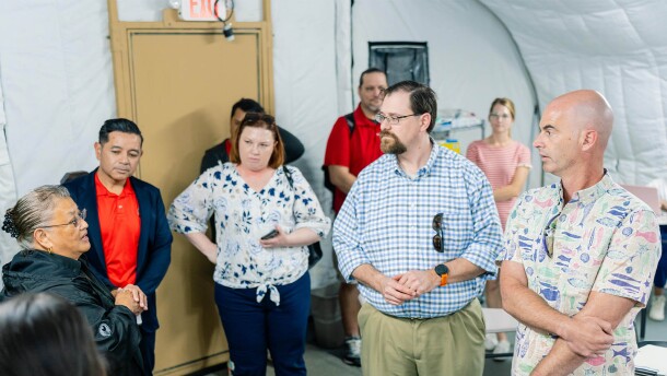 Helmsley Charitable Trust Trustee Walter Panzirer, Rural Healthcare Program Director Wayne Booze and Program Officer Elizabeth Ruen listen as Northern Marianas College Nursing Department Chair Rosa Aldan explains lab equipment during a recent site visit.