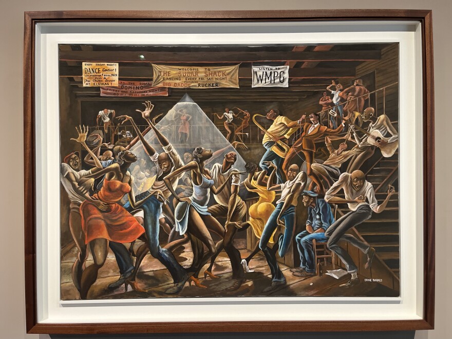 Renowned Durham artist Ernie Barnes’ painting "The Sugar Shack," which depicts a lively night at a dance hall in the segregated South during the 1950s, is on display at The Mint Museum in uptown Charlotte.