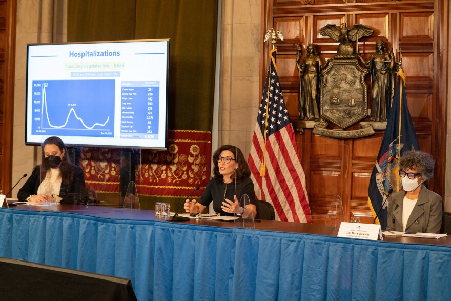 Gov. Kathy Hochul, center, speaks during a COVID-19 briefing in Albany Mon. December 27, 2021