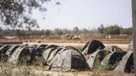 A camp set up by the Moroccan Royal Armed Forces to assist with the rescue mission for victims of the earthquake, in the town of Amizmiz, near Marrakech, Morocco, Monday, Sept. 11, 2023. Rescue crews expanded their efforts on Monday as the earthquake's death toll continued to climb to more than 2,400 and displaced people worried about where to find shelter. (Mosa'ab Elshamy/AP)