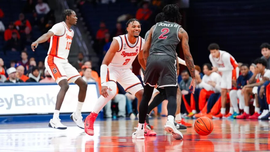 SU guard JJ Starling (2, White) defends Saint Joseph’s guard Deuce Jones