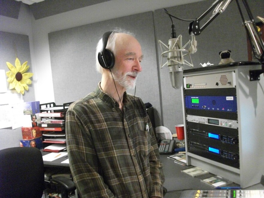 color photo of John Rittmeyer taking at the microphone