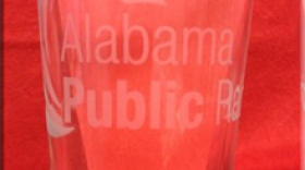 Clear 16 ounce Alabama Public Radio pint glass with logo etched on front