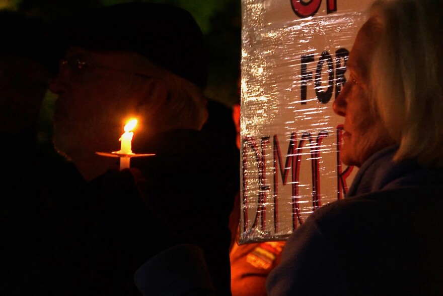 A small number of staff, students and faculty gathered at the Sample Gates Sunday night to celebrate a preliminary injunction against Indiana University's expressive activity policy's overnight restrictions.