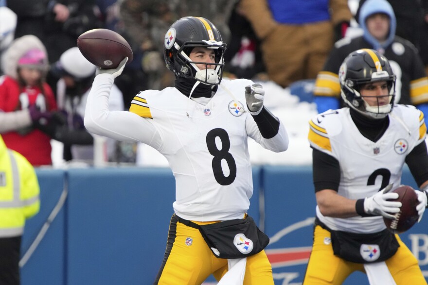 A Pittsburgh Steelers player throws a football.