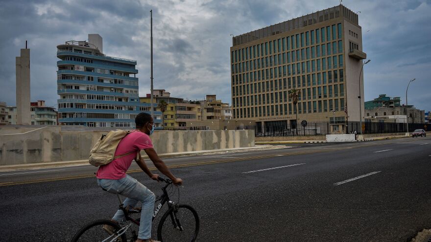 A man rides his bicycle near the U.S. Embassy in Havana on Jan. 12.