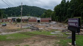 Debris surrounds Buckhorn school, which was badly damaged during historic flooding, in Buckhorn, Kentucky.