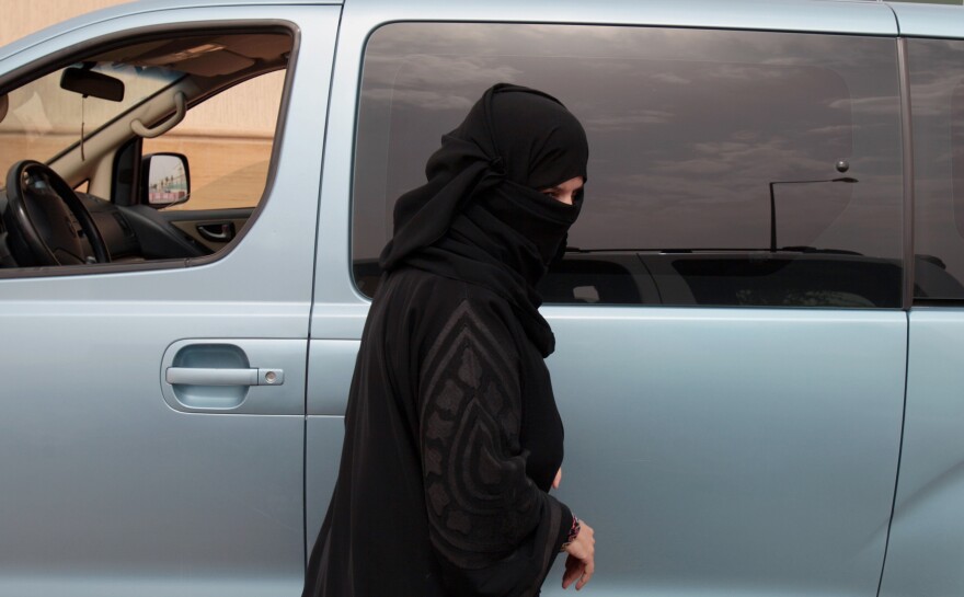 Activist Aziza Yousef, shown here stepping out of her car after driving on a Riyadh highway on March 29, 2014, as part of a campaign to defy Saudi Arabia's ban on women driving, is among several high-profile activists who were detained last month.