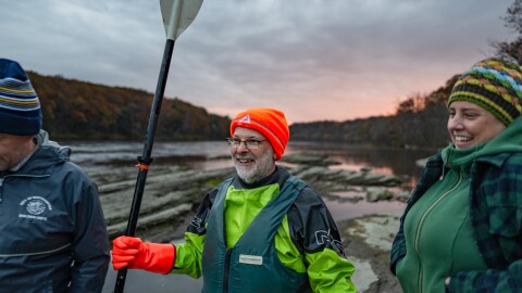 Dave Rothstein (center) aimed to break a world record -- and draw attention to the Connecticut River watershed -- as part of his great pumpkin paddle in 2023. 