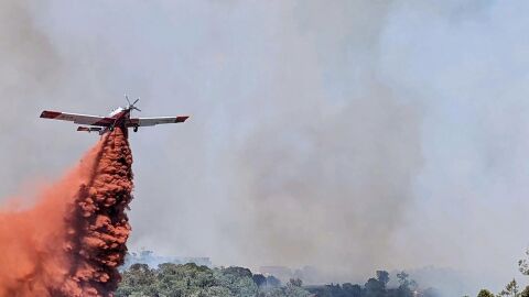 An airtanker helps put out the Spring Creek Fire near Parachute on Sunday, June 25, 2023.
