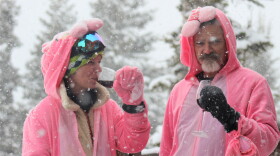 Brooke Nielsen and Jean Vansant polish off a bottle of red wine outside of the Sundeck Restaurant as spring snow falls on closing day.