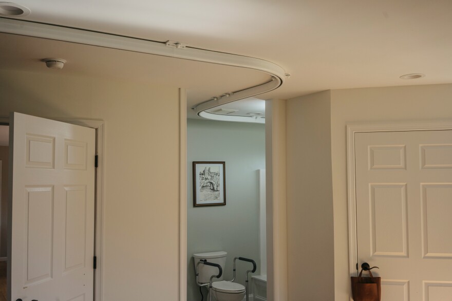 The track for a lift that runs from Izzie's bedroom to the bathroom helps her get out of bed or the shower.