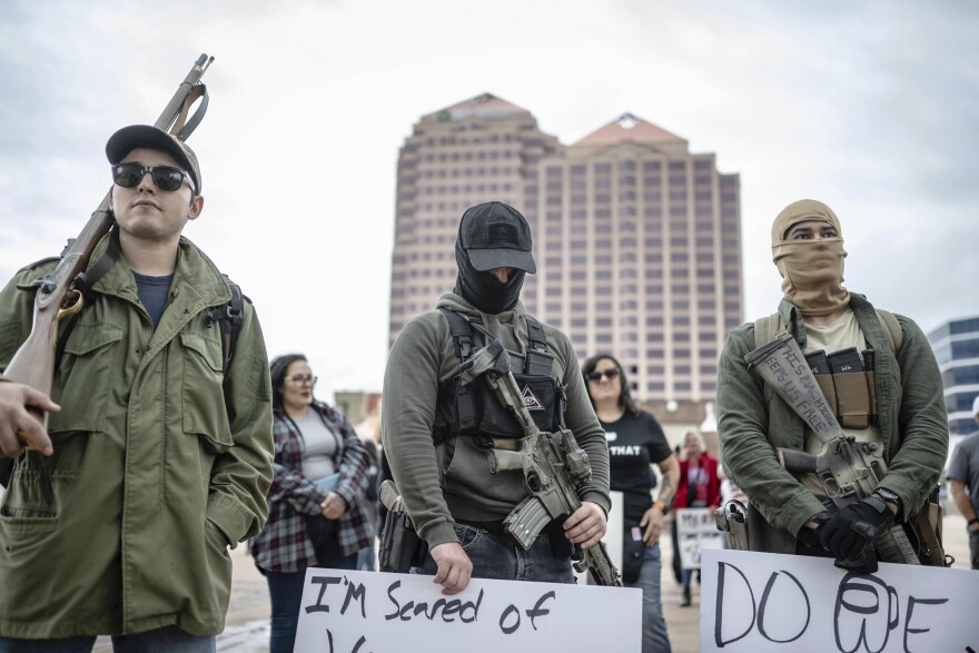 Demonstrators display open carry firearms at a Second Amendment Protest in response to Gov. Michelle Lujan Grisham's recent public health order suspending the conceal and open carry of guns in and around Albuquerque for 30-days, Tuesday, Sept. 12, 2023, in Albuquerque, N.M. (AP Photo/Roberto E. Rosales)