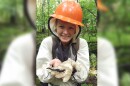 Alyssa Roberts shows off a salamander in the Chippewa National Forest. Roberts was recently among the probationary employees of the U.S. Forest Service who was fired by the Trump administration in February 2025.