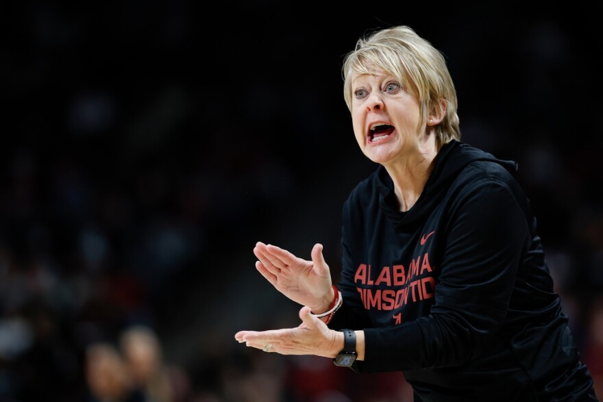 Woman shouts at a team 