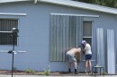 James Wolfe, 72, left, and Elaine Wolfe, 65, install shutters on their home in Vero Beach, Fla, Thursday, Aug. 29, 2019. The U.S. National Hurricane Center says Dorian could hit the Florida coast over the weekend as a major hurricane. 