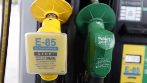 A fuel nozzle for E-85, left, and traditional gasoline is seen at a gas station in Batesville, Miss. in August of 2014. The Obama administration is boosting the amount of corn-based ethanol and other renewable fuels in the U.S. gasoline supply.