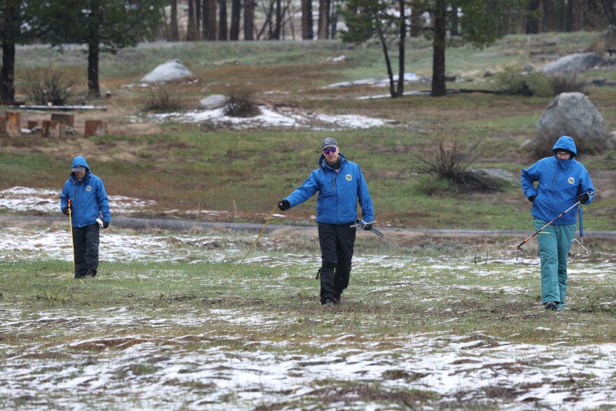 Left to right: The California Department of Water Resources Snow Survey and Water Supply Forecasting Unit Manager Andy Reising, Engineer Jacob Kollen, and California Cooperative Snow Surveys Unit Manager Jim Shannon conduct the fourth media snow survey of the 2026 season at Phillips Station in the Sierra Nevada on April 1, 2026.