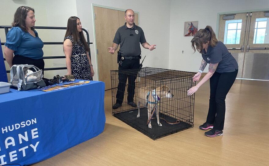 New York Homeland Security and Emergency Services Commissioner Jackie Bray, Mohawk Hudson Humane Society CEO Ashley Jeffrey Bouck, and Director of Outreach and Humane Law Enforcement Adam Fiumano and Kerouac, the dog and owner, at Mohawk Hudson Humane Society demonstrating pet safety.