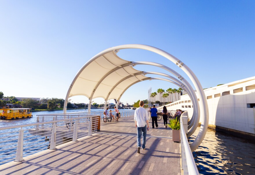 People walking along a river
