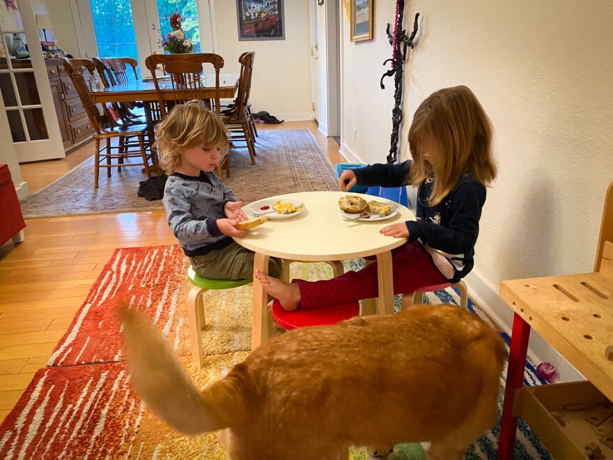 Abby Bucolo, right, eats breakfast with her brother Henry at a bed-and-breakfast their parents are renting after their home was destroyed by the Almeda Fire.