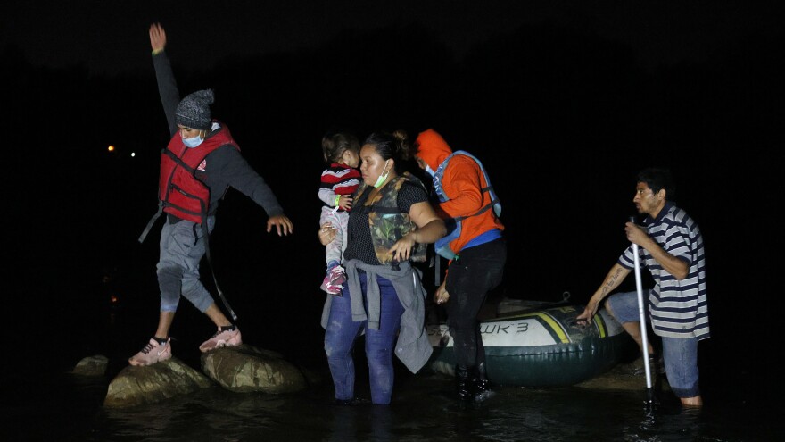 A group of migrants from El Salvador arrives in Roma, Texas, after crossing the Rio Grande on March 30, 2021 in Roma, Texas.