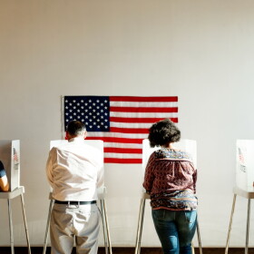 Exercising the right to vote.