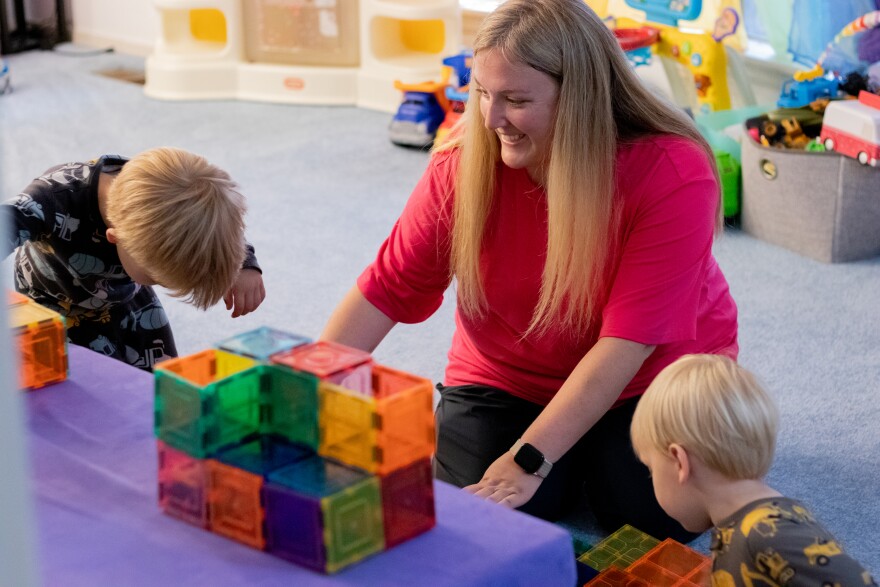 Jennifer Williams plays her sons in their "Blue room." Williams said she is able to bring her early childhood education experience to her role as a stay-at-home mother.
