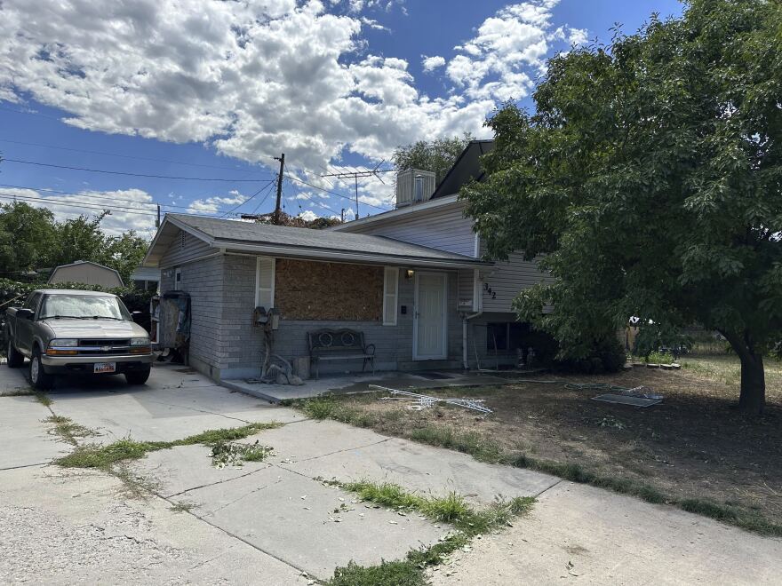 This photo shows a boarded up window and the front of the house of Craig Robertson, who was killed by FBI agents Wednesday during a confrontation after making violent threats against President Joseph Biden and other public officials, Thursday, Aug. 10, 2023 in Provo, Utah.
