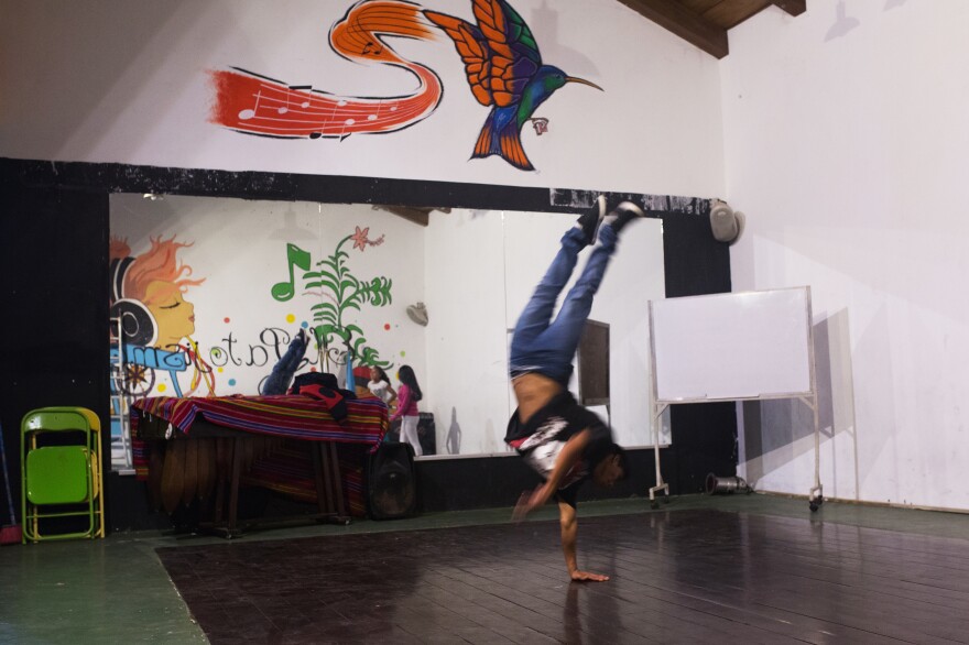 Jonathan Ramirez, 16, breakdances at Los Patojos. "We have four fundamentals here," says Rafael Fuentes, the education coordinator, "food, health, education and art. For us, art is just as important as math."