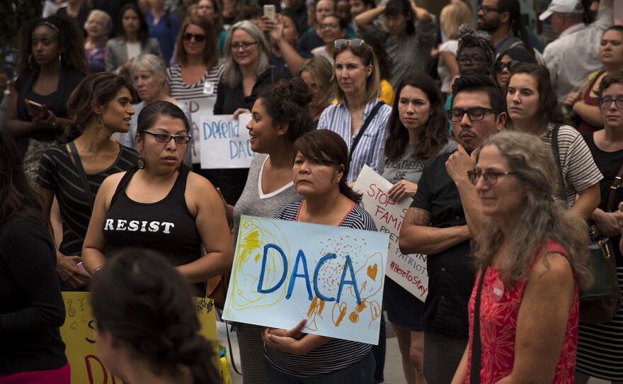 A crowd gathers during a community rally in support of DACA recipients on Tuesday, September 5, 2017, at El Centro De La Raza in Seattle. 